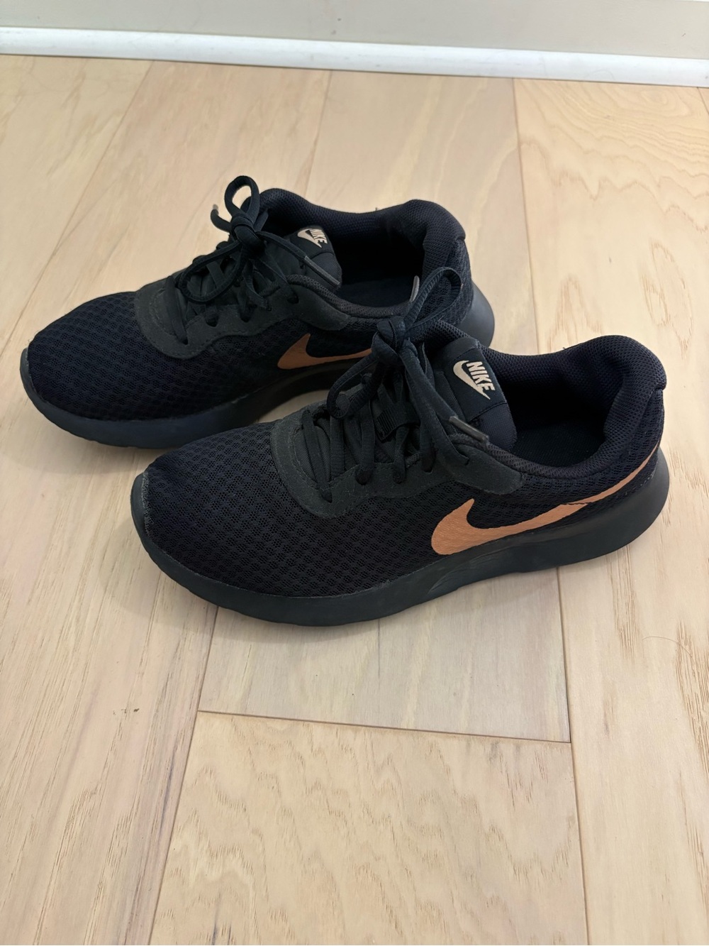 Nike Black Sneakers with Copper Swoosh Accent